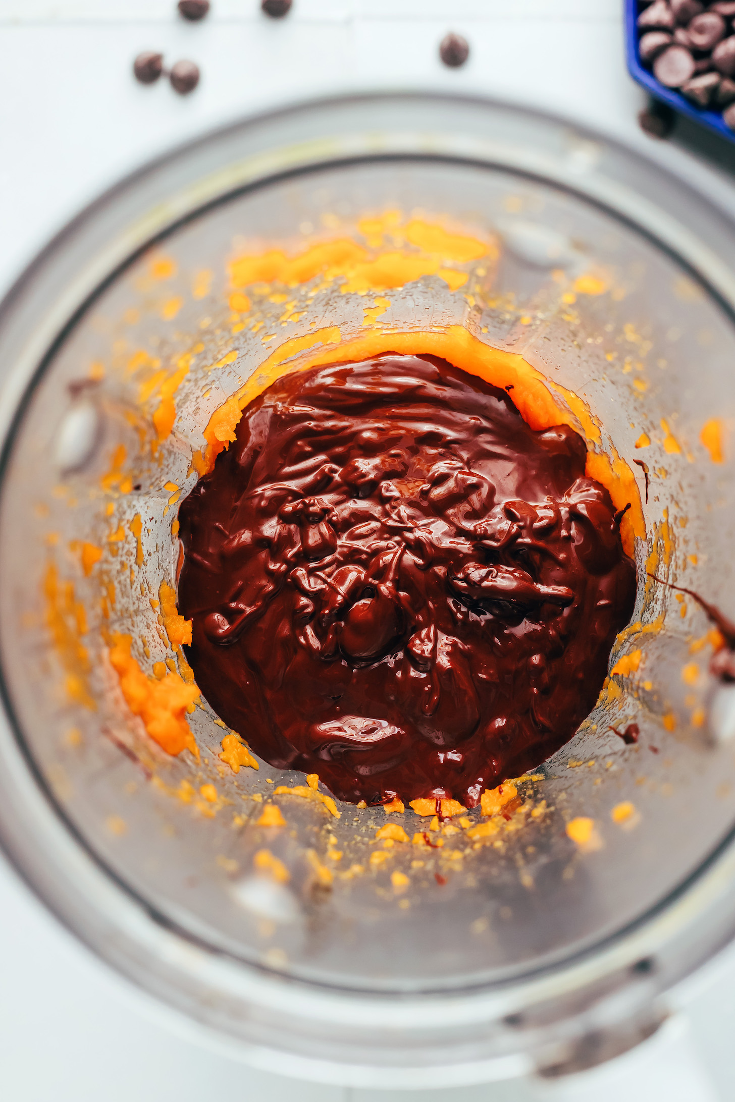 Melted dark chocolate and steamed sweet potato in a blender